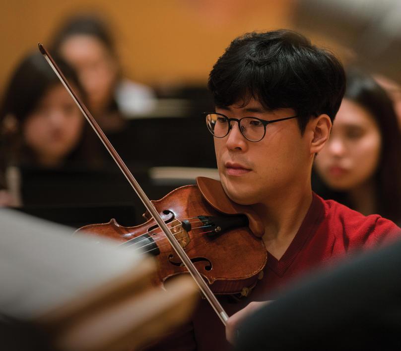 A violinist in orchestra practice